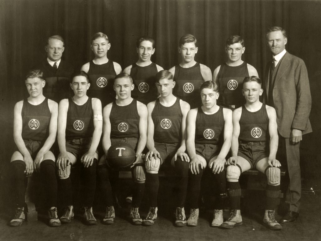Settlement house basketball team posing for photo