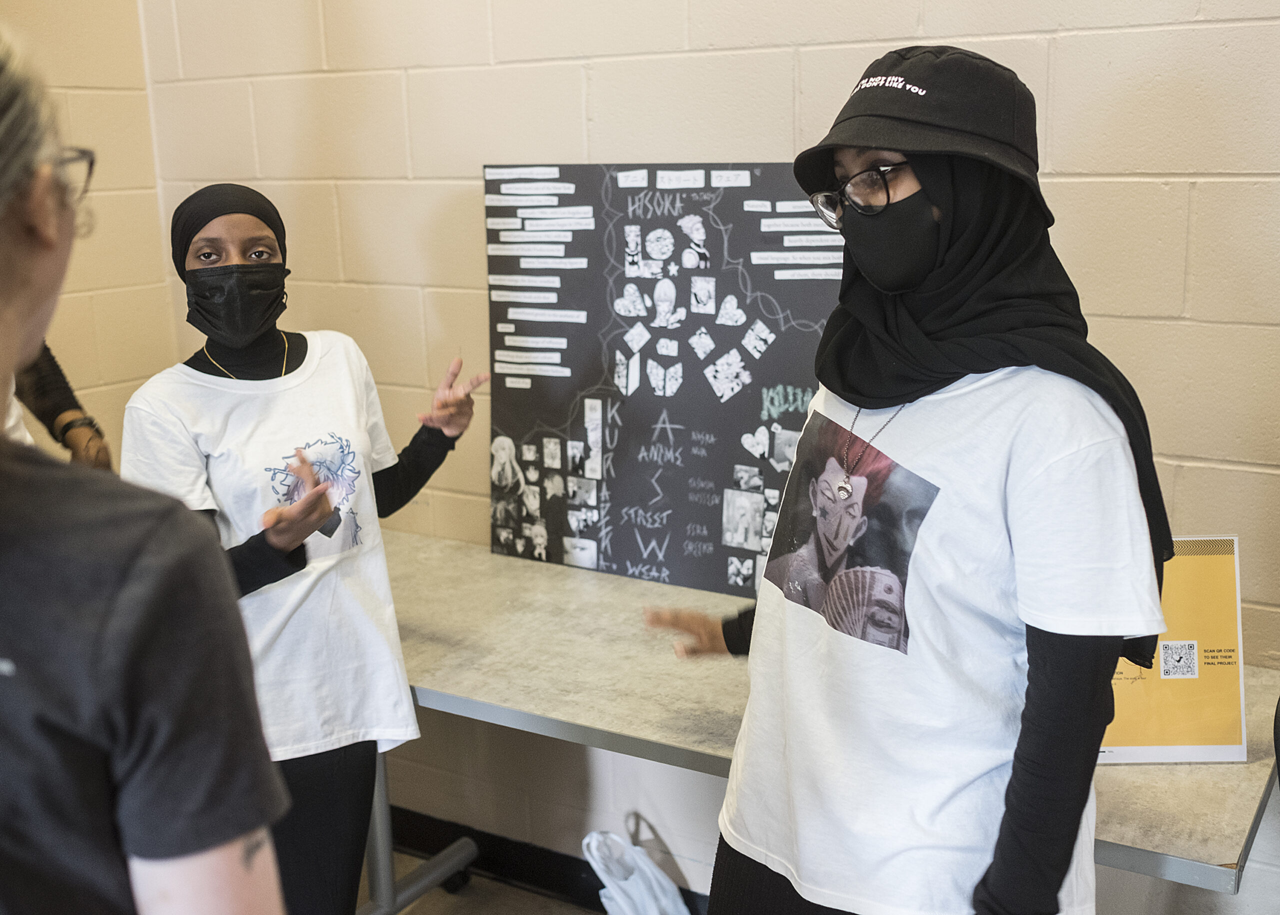 Young women displaying their summer work at Brian Coyle Center